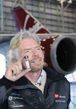 Richard Branson, founder of Virgin Atlantic Airlines, holds a bottle containing jet fuel made from vegetable oils. Virgin Atlantic made the first demonstration flight using biobased jet fuel in February and is one of many aviation companies promoting