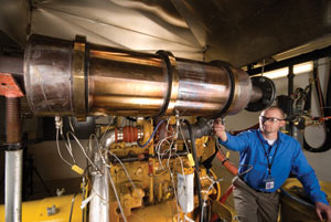 Aaron Williams, an engineer with the National Renewable Energy Laboratory, tests a urea SCR system. PHOTO: NREL