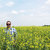 Alex Clayton, Nuseed Carinata global business development lead, stands in a field of carinita.       
