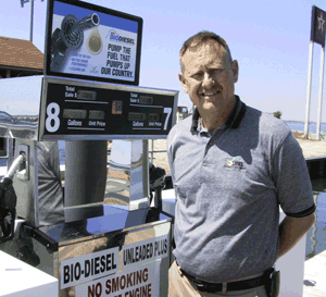 The United Soybean Board's Eric Niemann stands next to the B2 pump.