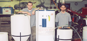 University of Tennessee students Scott Curran, left, and Sean Peterson stand near the biodiesel processor they built.
