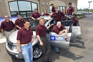 The Mississippi State University team poses with its "through-the-road" parallel hybrid electric 1.9-liter GM direct-injection turbo diesel engine vehicle fueled by B20.