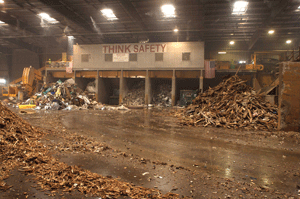 Continental Biomass Industries classifies C&D wood into "A" and "B" wood categories. "A" is clean, unadulterated wood, and "B" is the pressure-treated or painted, "dirty," wood. Shown above is the interior of a C&D processing facility where ?B? wood 