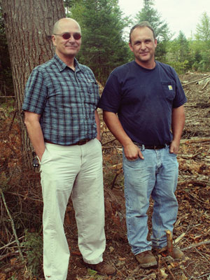 Pictured are, left, Boralex Procurement Supervisor Dumond and Terry Theriault, owner of Theriault Tree Harvesting. Both men's companies have benefitted from the equipment purchase arrangement Boralex has with many of its fuel suppliers./PHOTO: BORALE