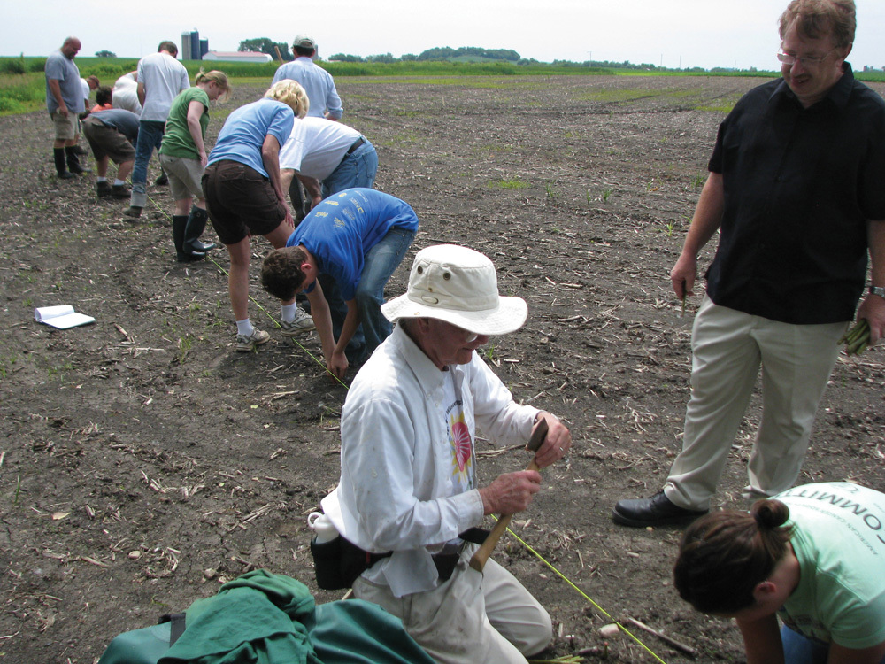 GROUNDWORK: A local farmer and researchers from Better Environmental Solutions, University of Wisconsin Soil Center, and Veridian Homes, work on a 2010 hybrid willow biomass restoration project in Wisconsin. 
