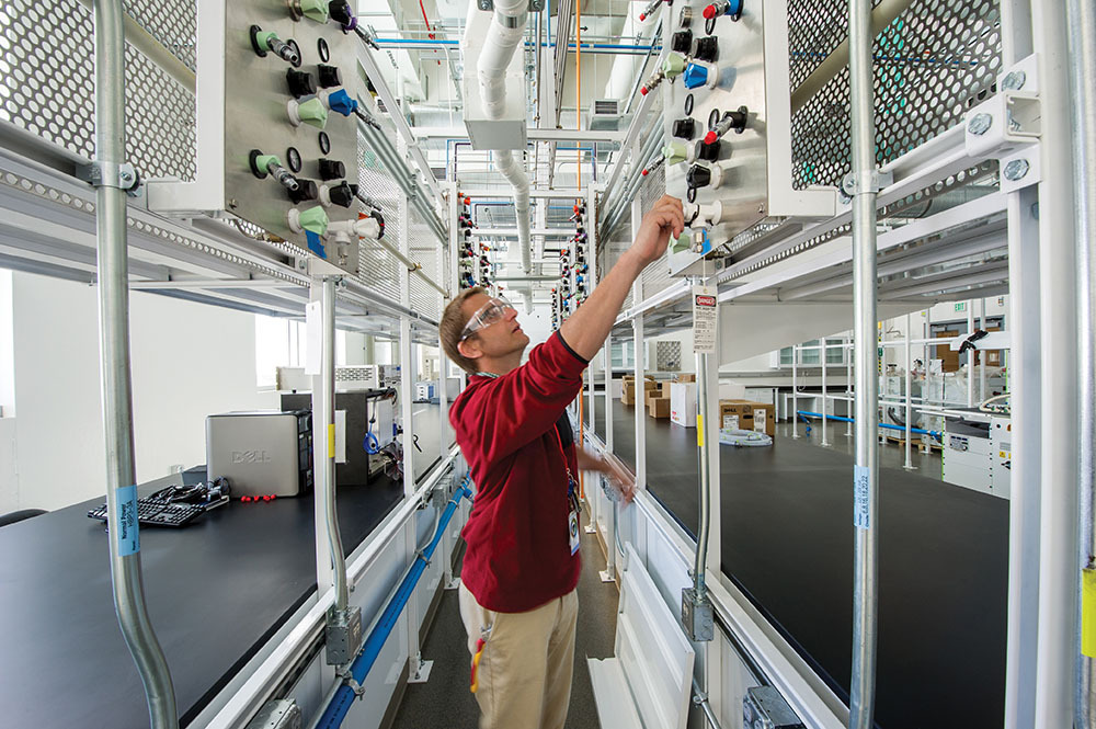 IN THE LAB: NREL researcher Guido Bender works in the gas manifold corridor for cell testing in the Fuel Cell Test and Development Laboratory at NREL.