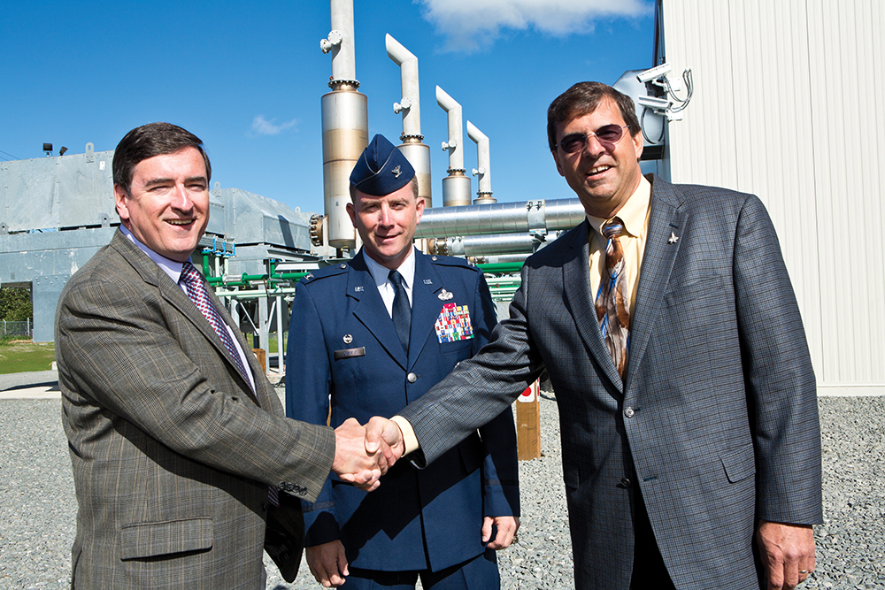 FIRING UP: Anchorage Mayor Dan Sullivan, Col. Brian Duffy, Base Commander of JBER, and Doyon Utilities President Dan Gavora at the commissioning of the Anchorage Landfill Gas-to-Energy Project.