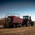 AGCOâ€™s large square baler makes its way through a field of corn stover. 