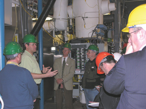 Calvin Feik of the National Renewable Energy Laboratory explains to visitors how the thermochemical pilot plant at the Golden, Colo.-based DOE lab works. 