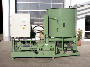 The RUF briquetter takes in sawdust and produces compressed burnable bricks.