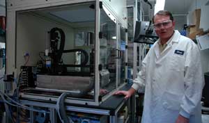 Hughes is pictured in his lab at the National Center for Agricultural Utilization Research. He developed this robotic platform for fully-automated molecular biology routines.