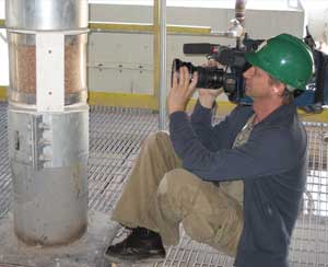 Hart gets footage of the grain that is used to produce ethanol and wheat gluten at White Energy Russell LLC in Kansas.