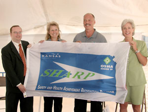 Left to right: Jim Garner, secretary of the Kansas Department of Labor; Barb Elliot, quality control manager for White Energy's Russell facility; Kuykendall, CEO of White Energy; and Gov. Sebelius.