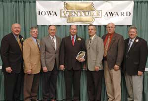 VeraSun Charles City LLC Plant Manager Todd Church holds an Iowa Venture Award presented by the Iowa Area Development Group.