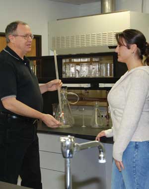 Instructor Randy Sigle, left, shares information with student Tammy Suckstorf