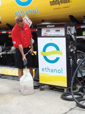 An Indy Racing League official fills a tank with racing-grade ethanol. 