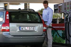 A man fills up a flexible-fuel Volvo V50 with E85 at a filling station in Sweden. 