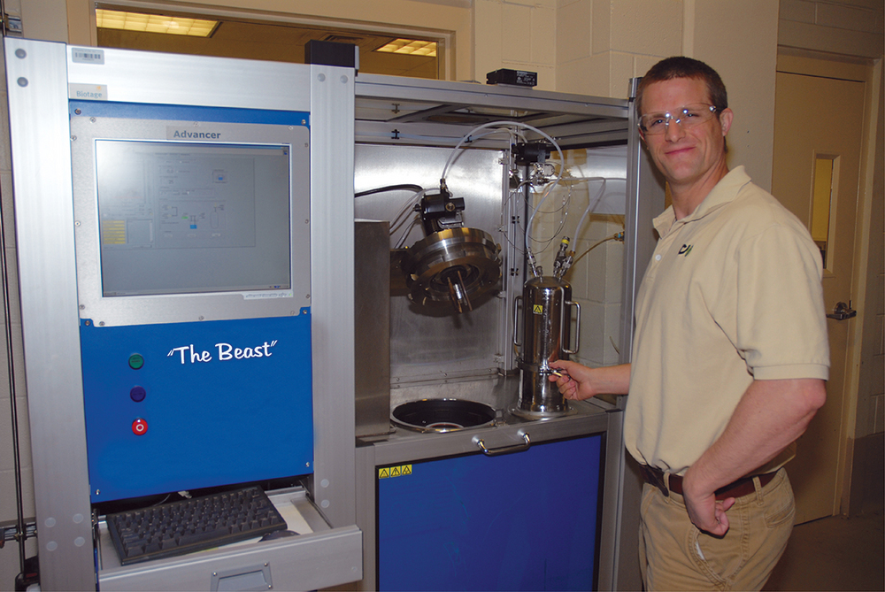 ICM scientist Chris Gerken stands by the Beast, the flask reactor used in the early stage of the companyâ€™s cellulosic ethanol research.  